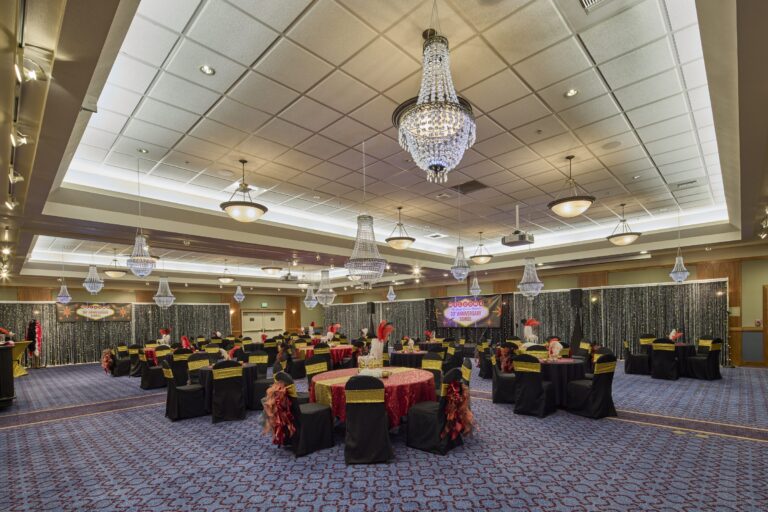 The Northwest Ballroom set for a banquet, with round tables and chandeliers