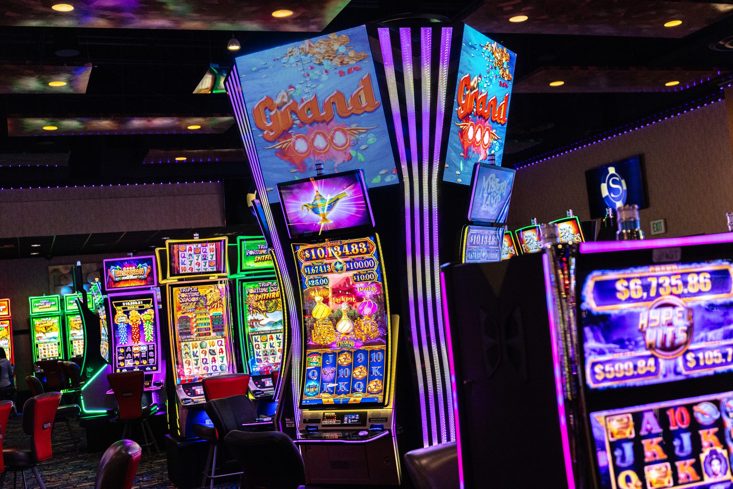 A progressive jackpot tower on the casino floor, the Skagit logo on the wall behind it